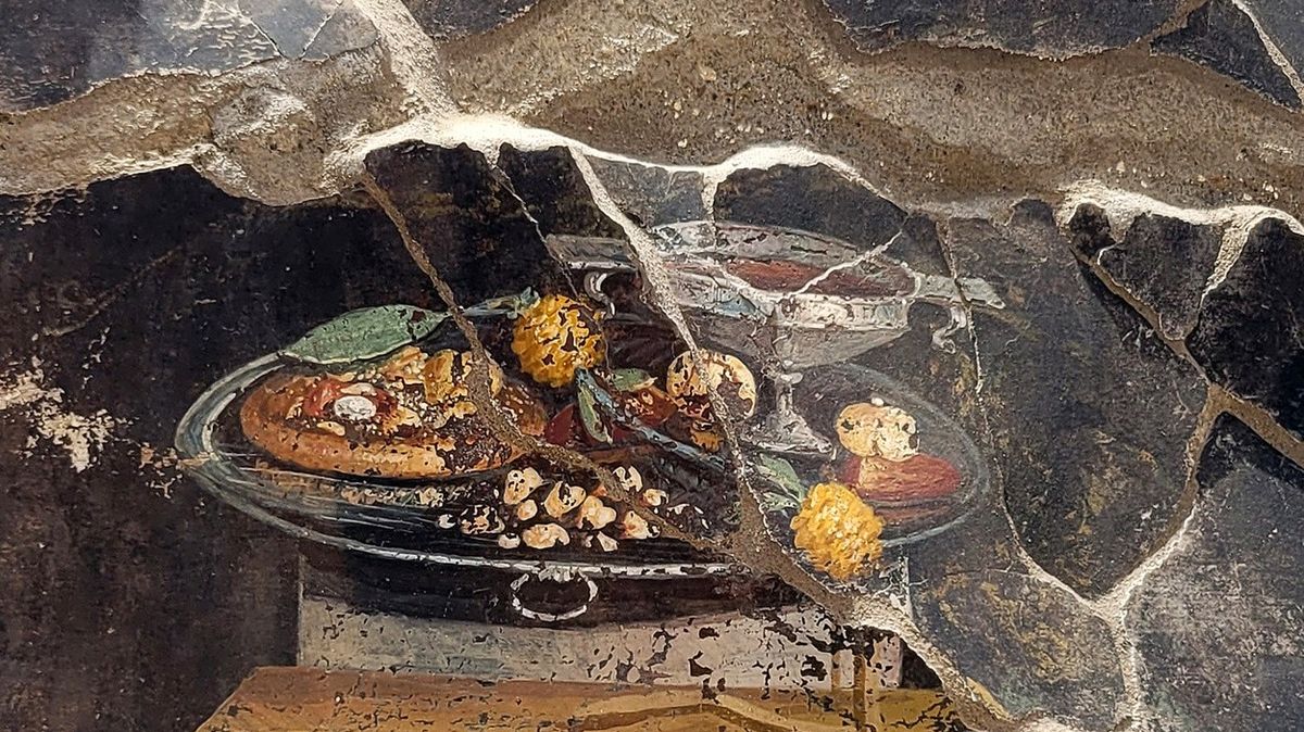 Pizza je možná starší, než si myslíme, naznačuje 2000 let stará malba z Pompejí
